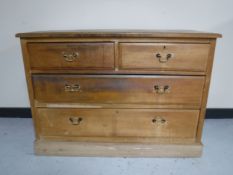 An Edwardian satin walnut four drawer chest