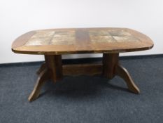 A continental oak tile topped dining table