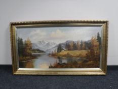 An ornate gilt framed oil on canvas - Dwelling in a mountainous landscape