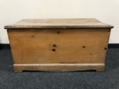 An antique pine blanket box
