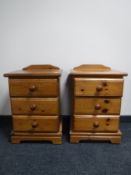 A pair of pine three drawer bedside chests