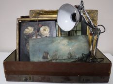 A vintage leather case containing an angle poised lamp,