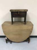 An oak barley twist drop leaf table together with an early twentieth century storage cracket stool