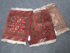 Three fringed Persian rugs
