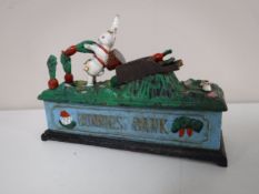 A cast iron Bunnies saving bank CONDITION REPORT: This is modern.