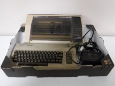 A box of Commodore Omega 64 and a Commodore matrix printer