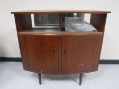 A mid twentieth century teak cocktail bar