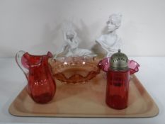 A tray of three pieces of cranberry glass ware, a bust,