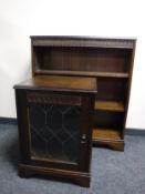 A reproduction oak audio cabinet together with matching bookshelves