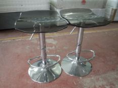 A pair of contemporary gas lift stools