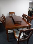 An eight piece reproduction Regency style dining room suite comprising of serpentine fronted