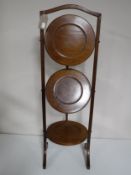 A Victorian mahogany folding cake stand
