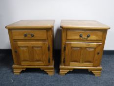 A pair of contemporary oak bedside chests