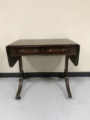 A mahogany sofa table fitted with two drawers