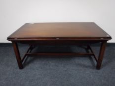 A mahogany flap sided coffee table
