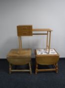 A mid twentieth century Danish teak telephone table together with two blond oak drop leaf tables