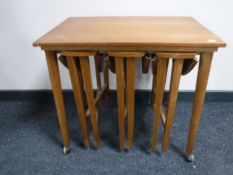 A nest of four twentieth century teak tables