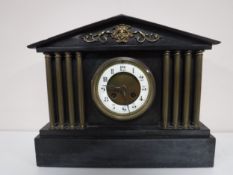 A Victorian slate mantel clock.