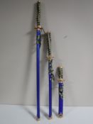 Three graduated Samurai swords