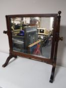 An antique mahogany toilet mirror