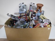 A box of boxed and un-boxed action figures including Star Wars, A Team,