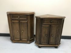 An oak double door cabinet with matching corner stand