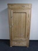 An antique pine hall wardrobe