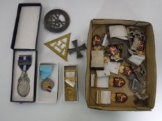 A box of Freemasons medals and badges