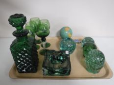 A tray of Victorian glass paperweights, green glass decanter, glass ware,