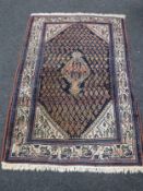 A Persian rug on blue ground