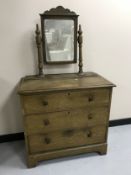An antique pine dressing chest