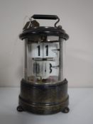 An early 20th century sterling silver cylindrical desk calendar.