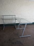 A contemporary metal and glass corner desk