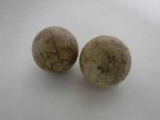 Two antique ivory bowling jacks