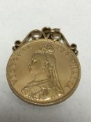 A mounted silver-gilt four shilling coin pendant