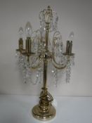 A brass five way decorative table lamp with glass drops