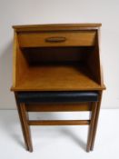 A mid twentieth century teak telephone table