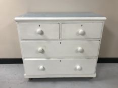 An antique pine four drawer chest CONDITION REPORT: 83cm high by 90cm wide by 44cm