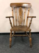 A Victorian elm armchair