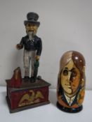 A cast iron Uncle Sam savings bank together with a set of Beatles dolls