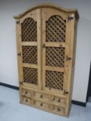 A Barker and Stonehouse Mexican pine drinks cabinet