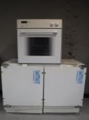 An intergrated fridge freezer and electric oven