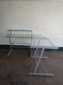 A contemporary metal and glass corner desk