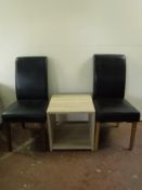 Two odd high backed leather chairs together with a two tier side table
