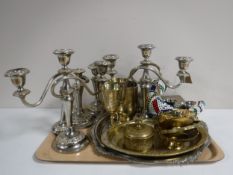 A tray of plated candelabra and candlesticks, plated rose ball, milk jugs,
