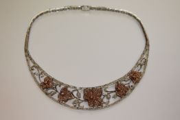 An impressive 18ct white and rose gold diamond set necklace,