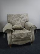 A contemporary armchair upholstered in floral print