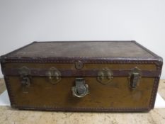 An early twentieth century metal bound travelling trunk