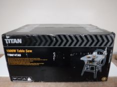 A boxed Titan 1500 W table saw and a cased Disto Leica meter