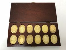 A boxed set of ten commemorative silver-gilt coins,